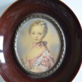 Miniature portrait of a young girl, framed and under glass