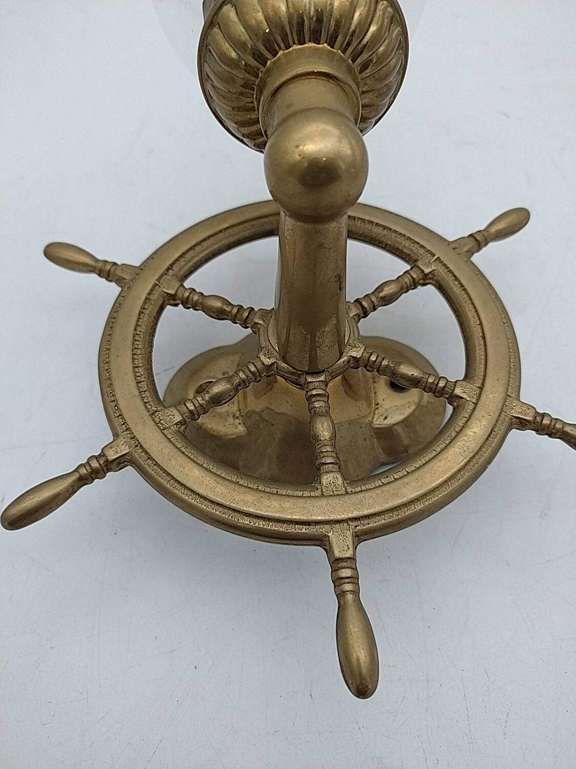 Brass wall sconces with nautical decor