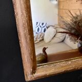 Patinated gilded mirror in wood and plaster