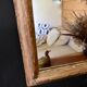 Patinated gilded mirror in wood and plaster