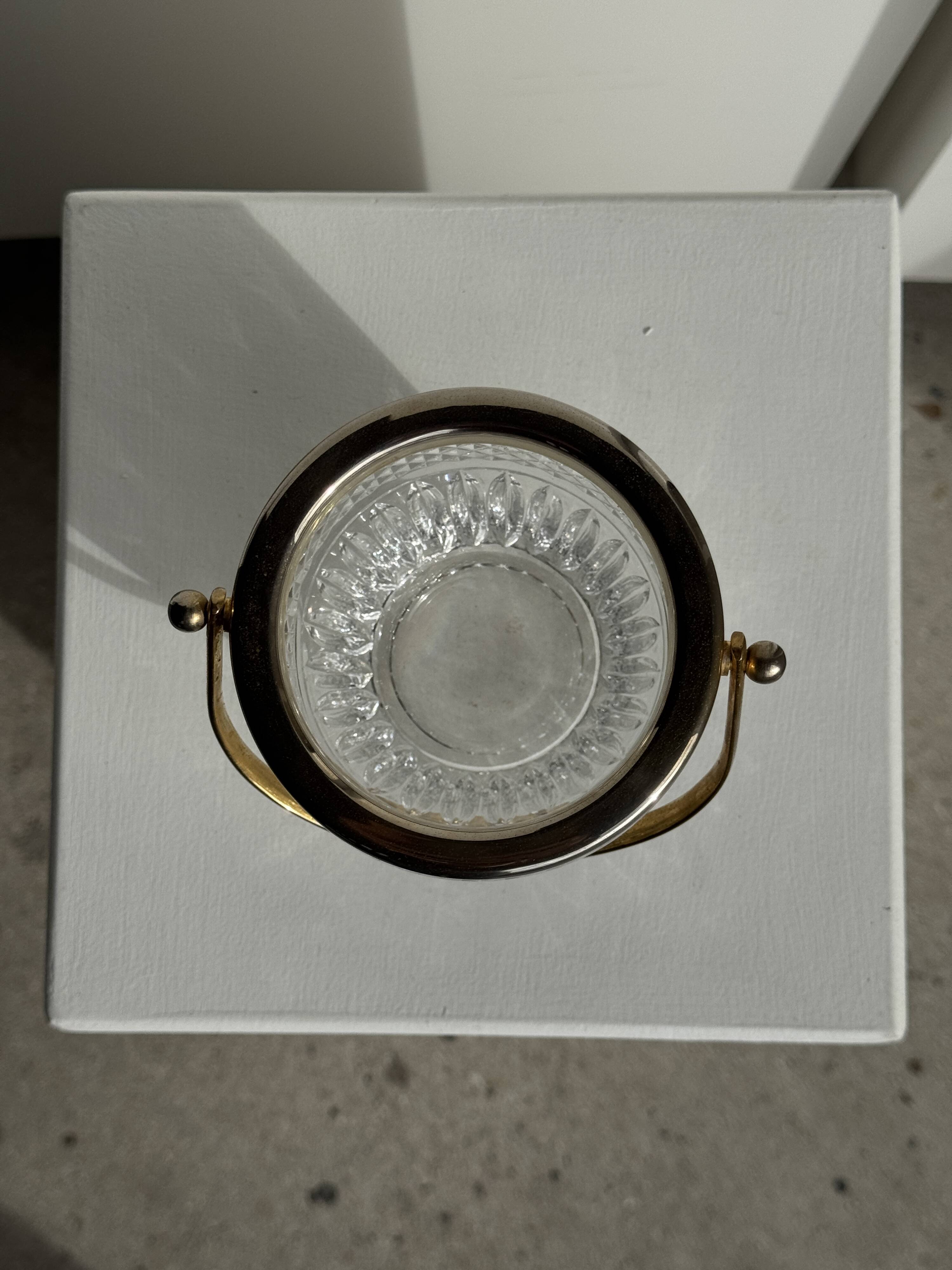 Small golden glass ice bucket with diamond point design and its scoop.