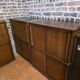 Modular corner library Oscar from the 1960s with sliding doors.