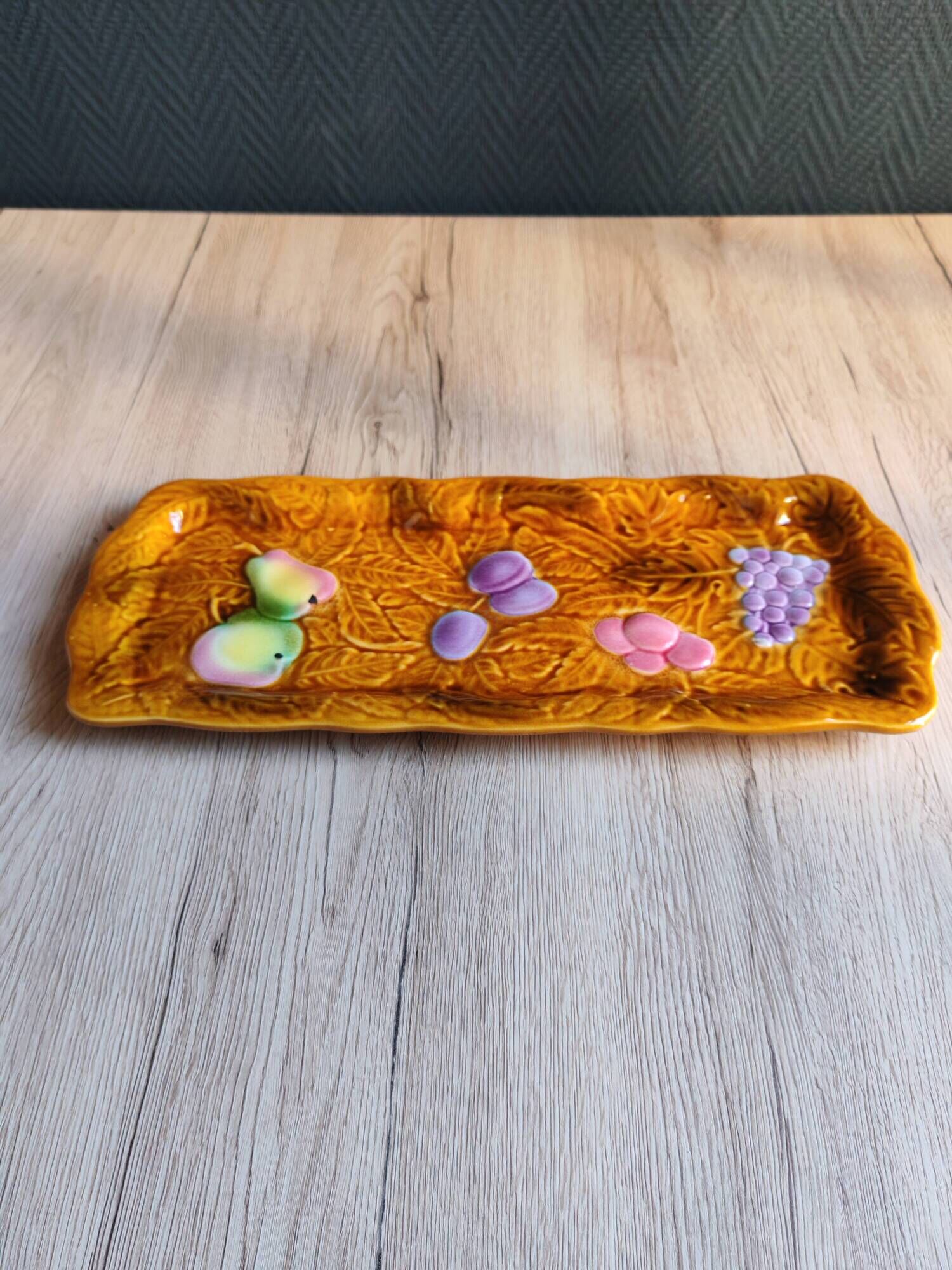 Vintage barbotine pocket dish from Salins les Bains, relief decoration of fruits.