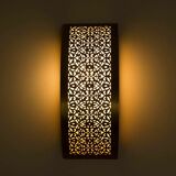Moroccan brass wall light with intricate floral decoration