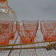 Vintage pink decanter with its 6 glasses