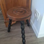 Brown and black wooden tripod stool