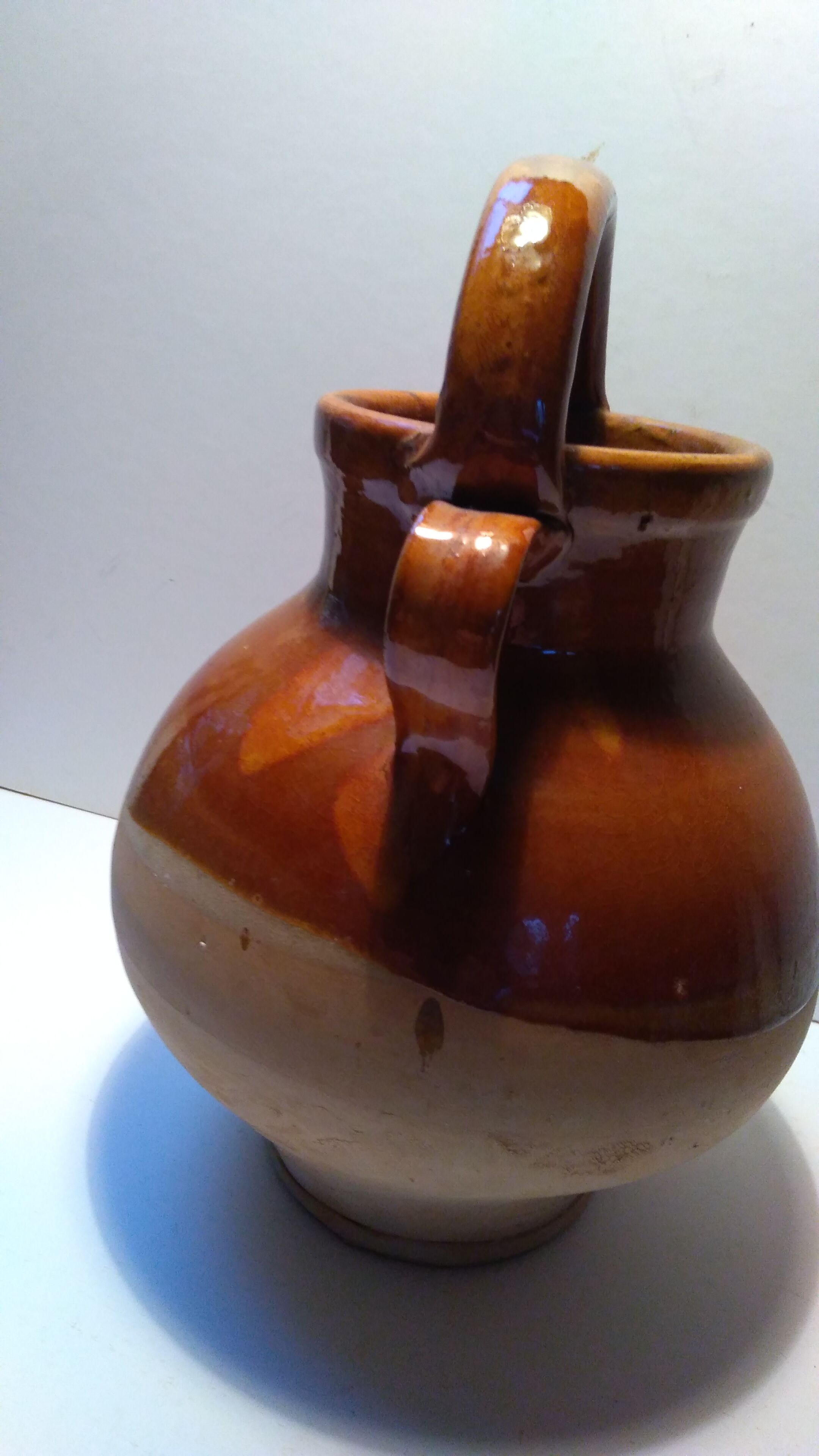 Old glazed earth jug