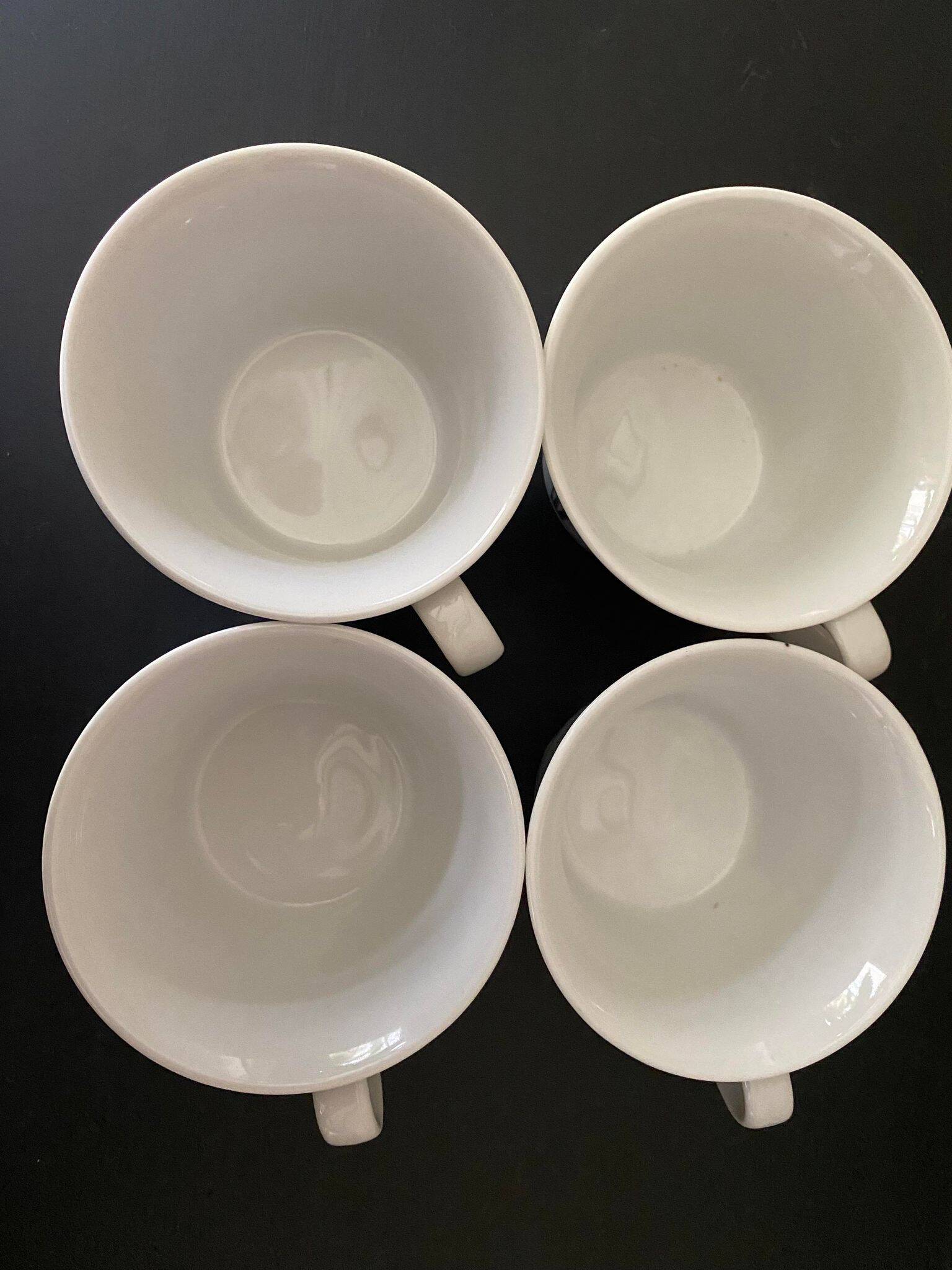 4 fine white porcelain cups with fine flower decoration