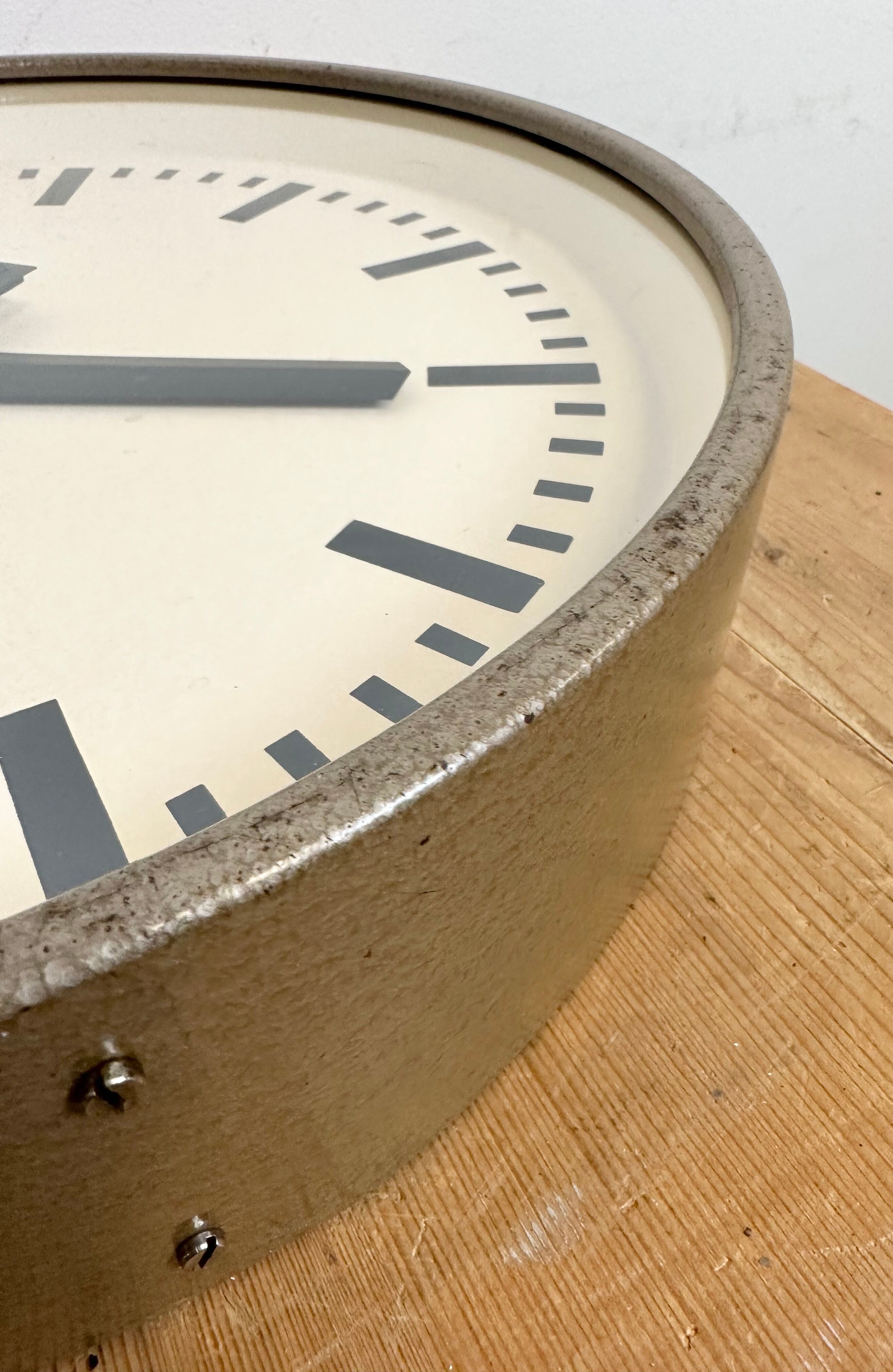 Brown industrial factory wall clock from Pragotron, 1960s