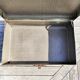 Brown vintage suitcase with CHENEY England brand travel tags