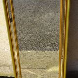 Hall mirror, gilded frame with fillets and fleur-de-lis.