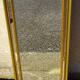 Hall mirror, gilded frame with fillets and fleur-de-lis.