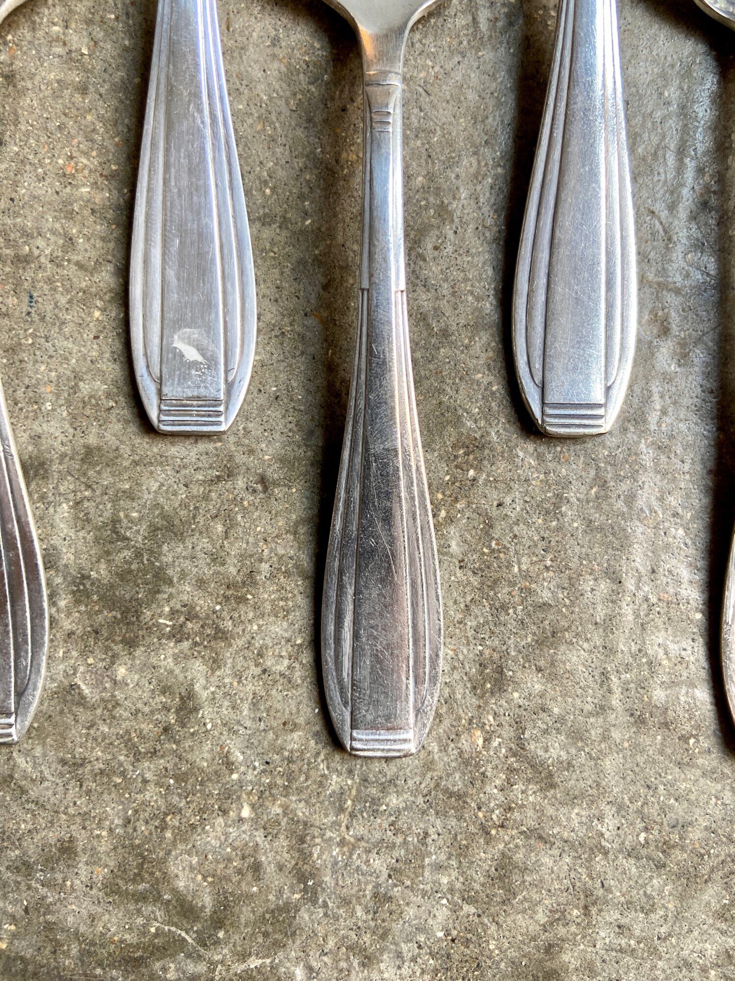 6 silver metal spoons