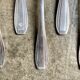 6 silver metal spoons