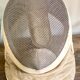Old fencing mask set and its foil