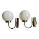 Pair of chrome metal wall lights with white glass globe.