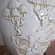 Pair of relief enameled porcelain lamps, Asian motif