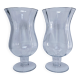 Pair of tall clear glass candlesticks from the early 20th century