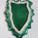 empty green ceramic pocket cup, small chips on the edges, signed