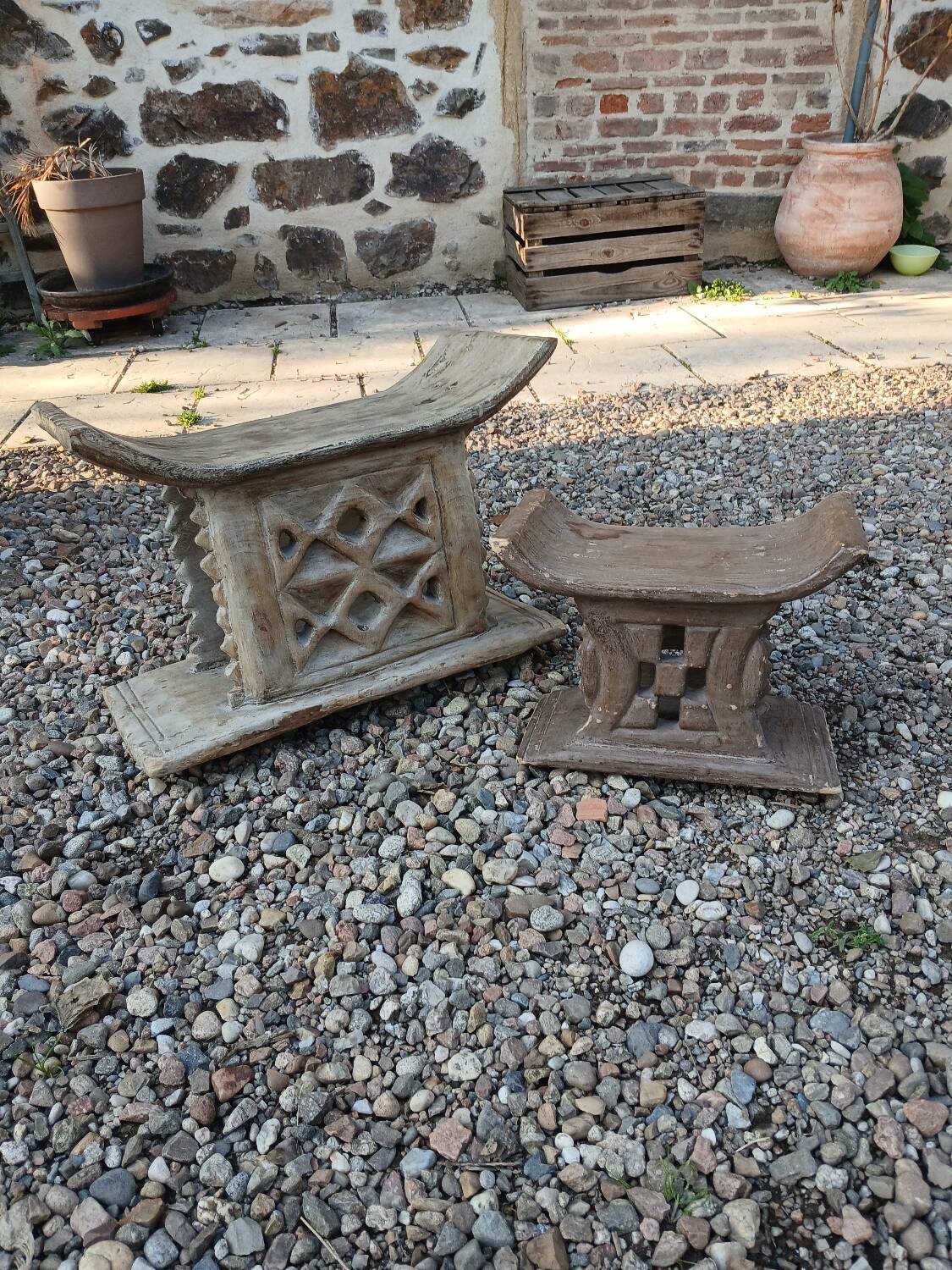 2 African carved wooden stools