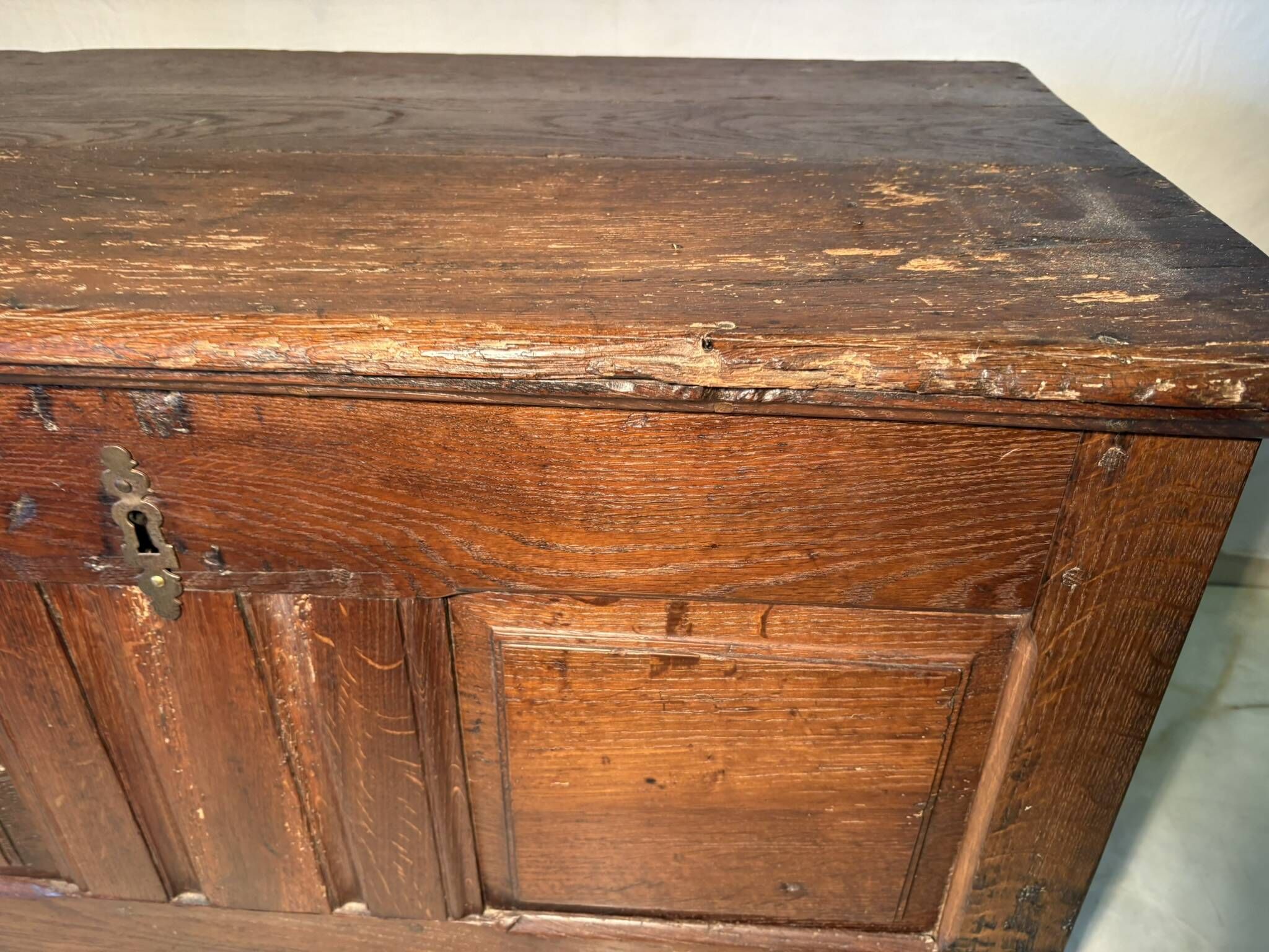 Rustic antique oak chest, original fittings and moulded panels.