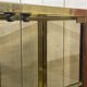 Pair of display cases in gilded chrome and smoked glass - 1980s