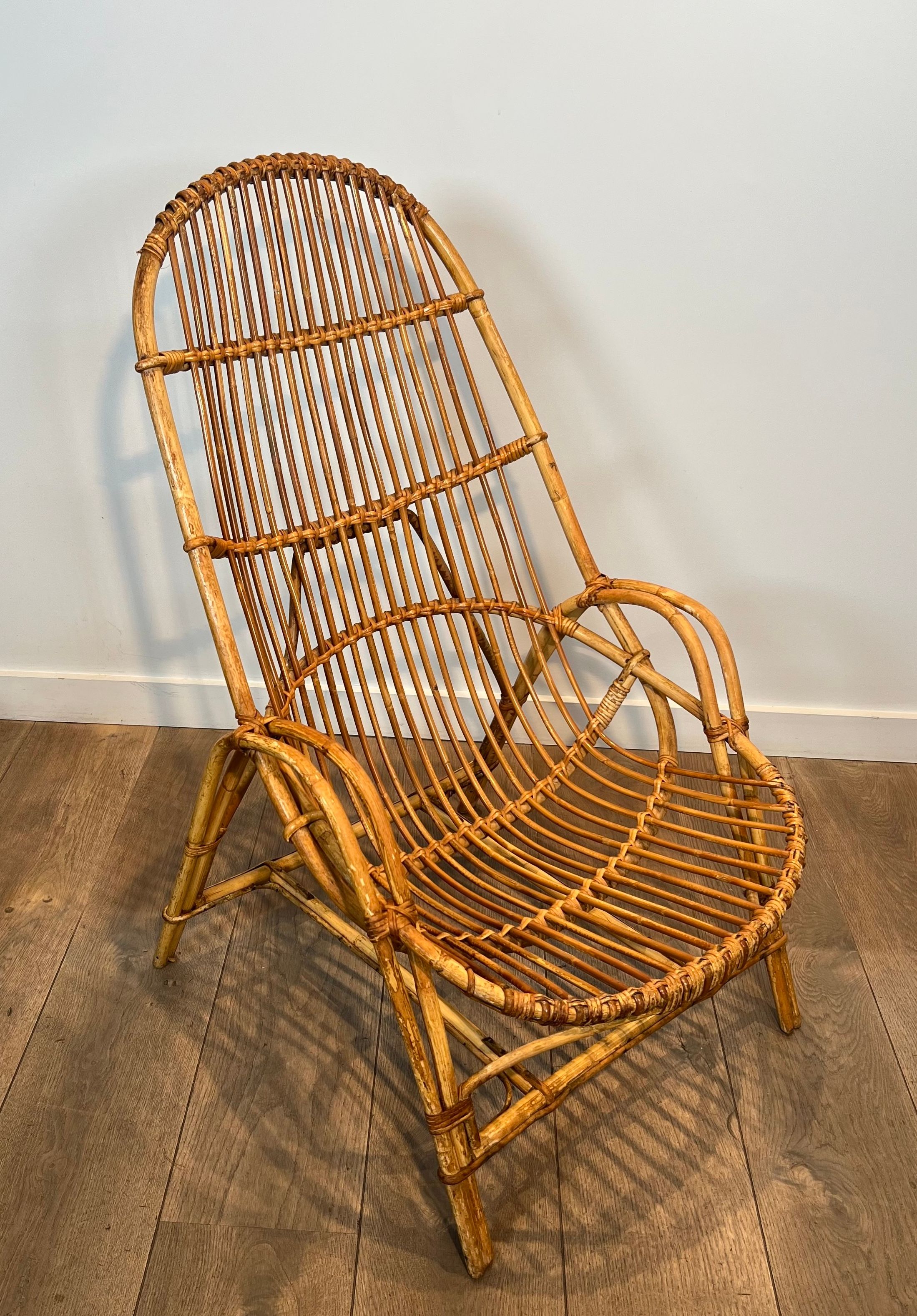 Pair of designer armchairs in rattan