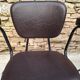 Brown faux leather armchairs