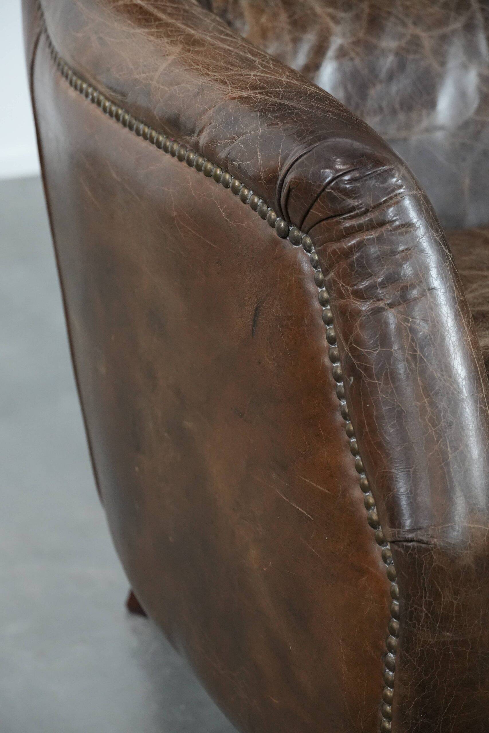 Very comfortable vintage cow leather armchair with character