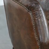 Very comfortable vintage cow leather armchair with character