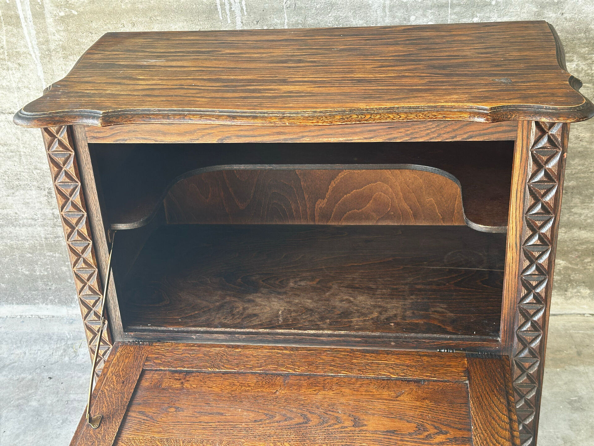 Small storage cabinet in carved oak – circa 1930