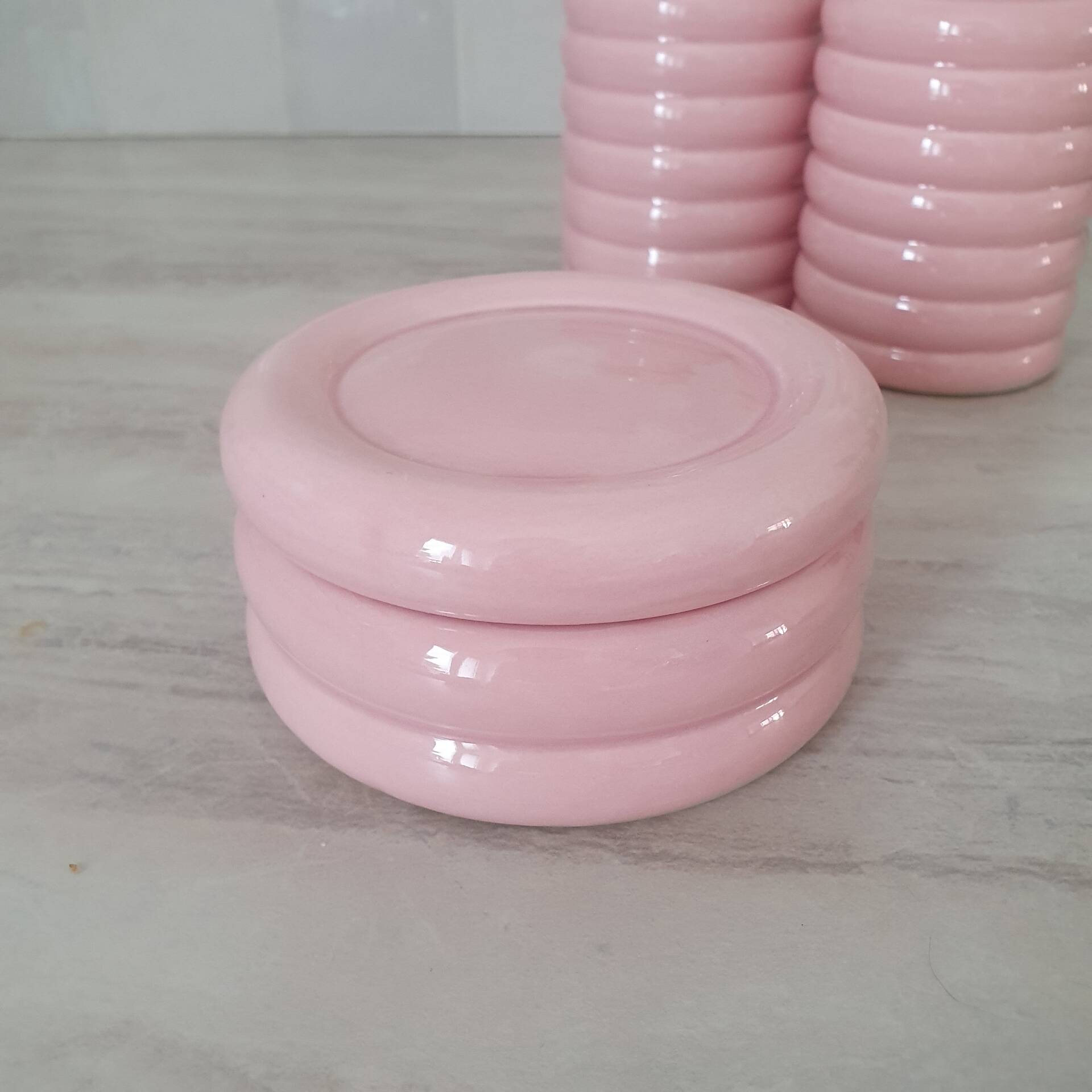 Set of pink and gold ceramic bathroom accessories
