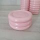 Set of pink and gold ceramic bathroom accessories