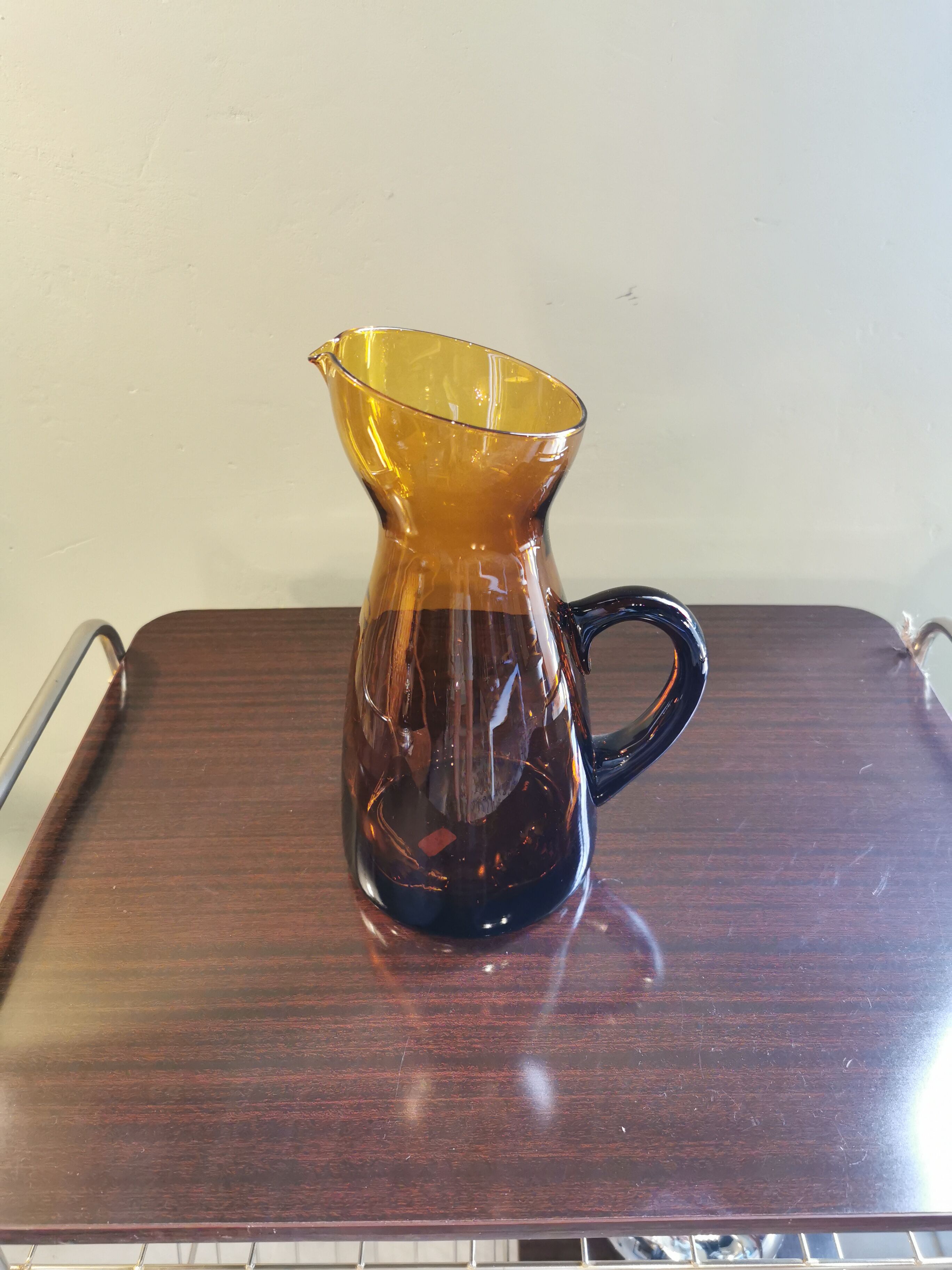 Vintage pitcher in amber glass