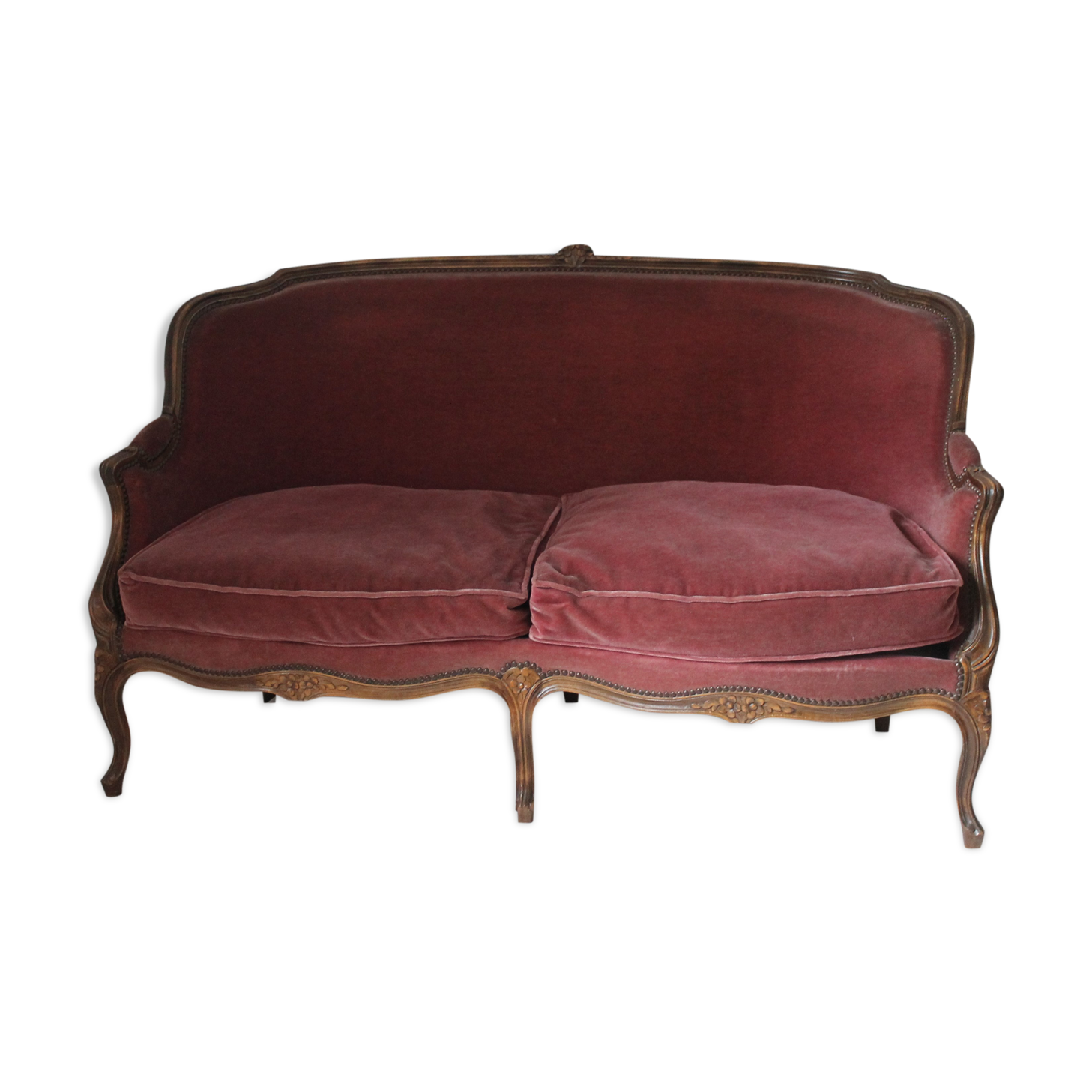 Faded pink velvet sofa