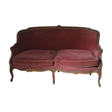 Faded pink velvet sofa