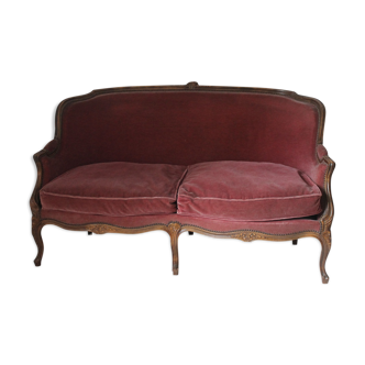 Faded pink velvet sofa