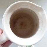Old earthenware pitcher with its lid