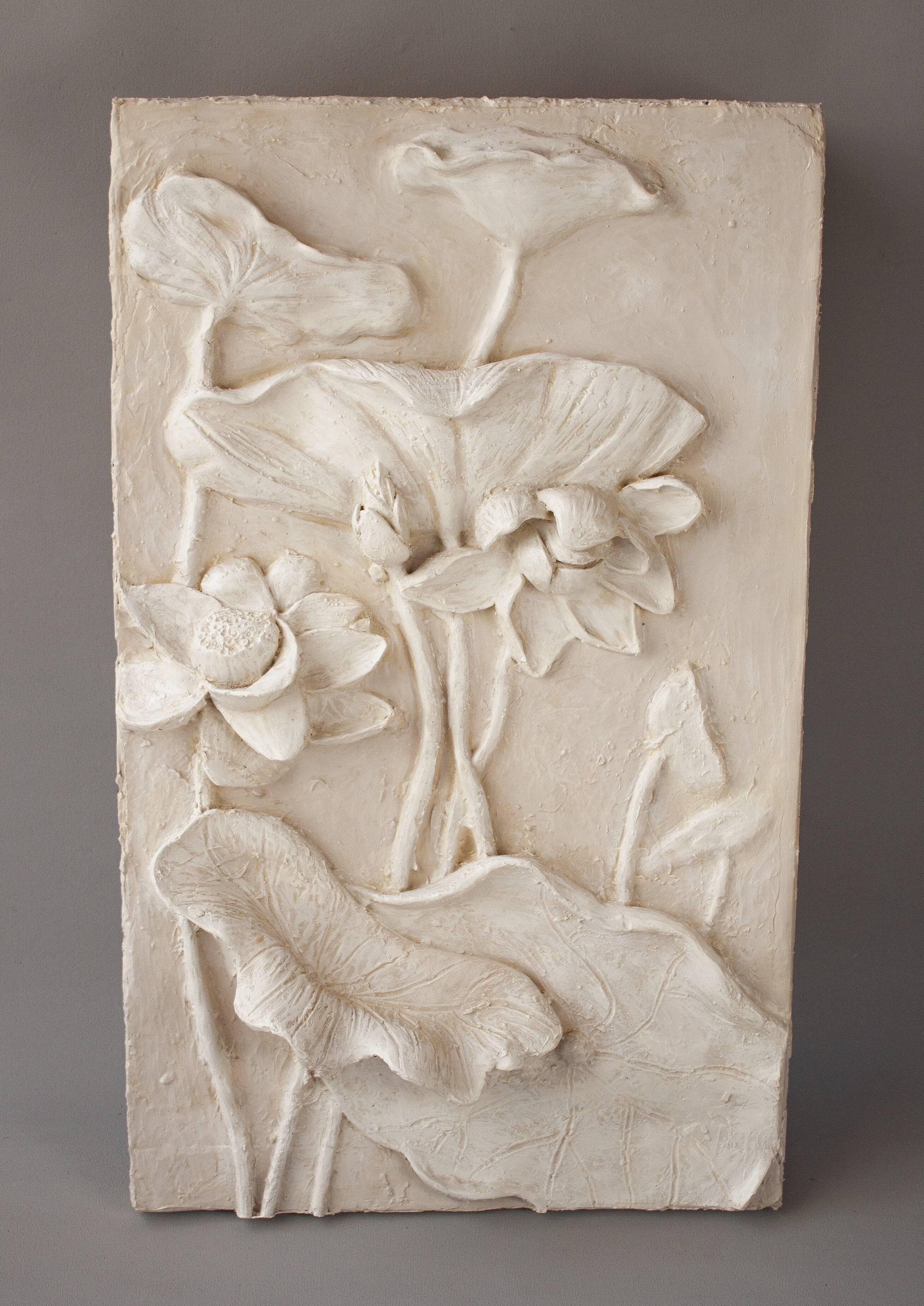 Bas-relief with flowers. Relief with flowers. Flowers in relief.