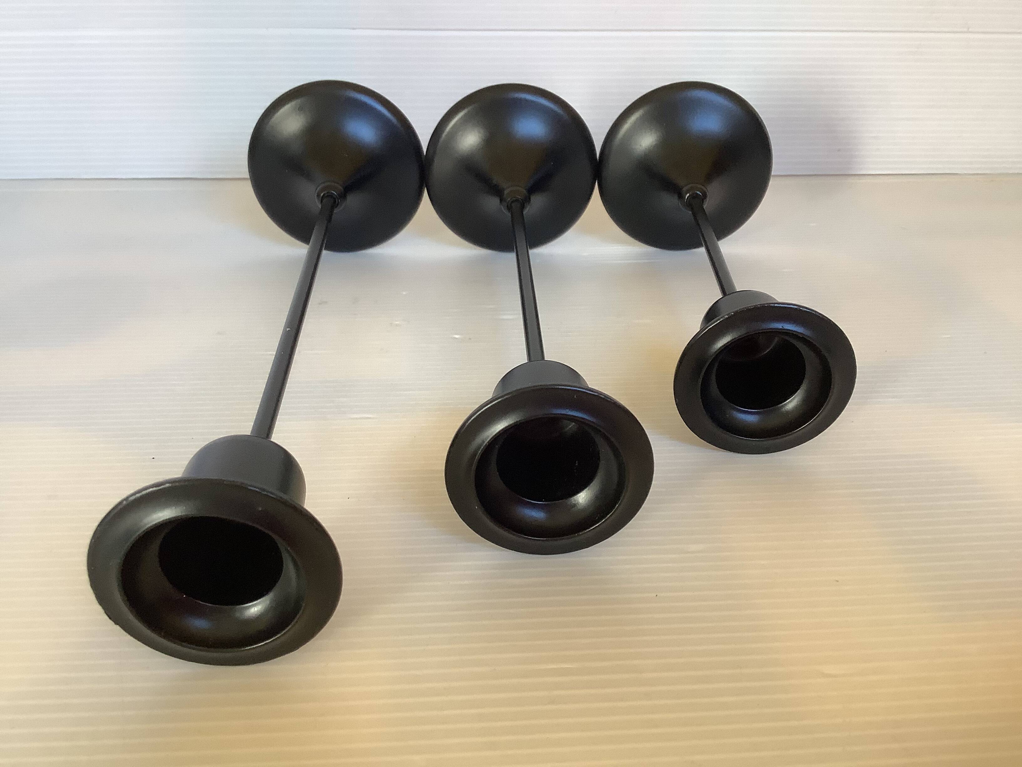 Trio of Scandinavian candlesticks with black tulip base