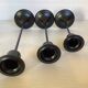 Trio of Scandinavian candlesticks with black tulip base