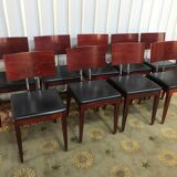 Suite of 9 black skai chairs and scandinavian chrome