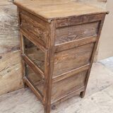 Old glazed bedside table in Burmese teak - right opening