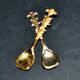 Set of 2 vintage gold metal salt spoons.