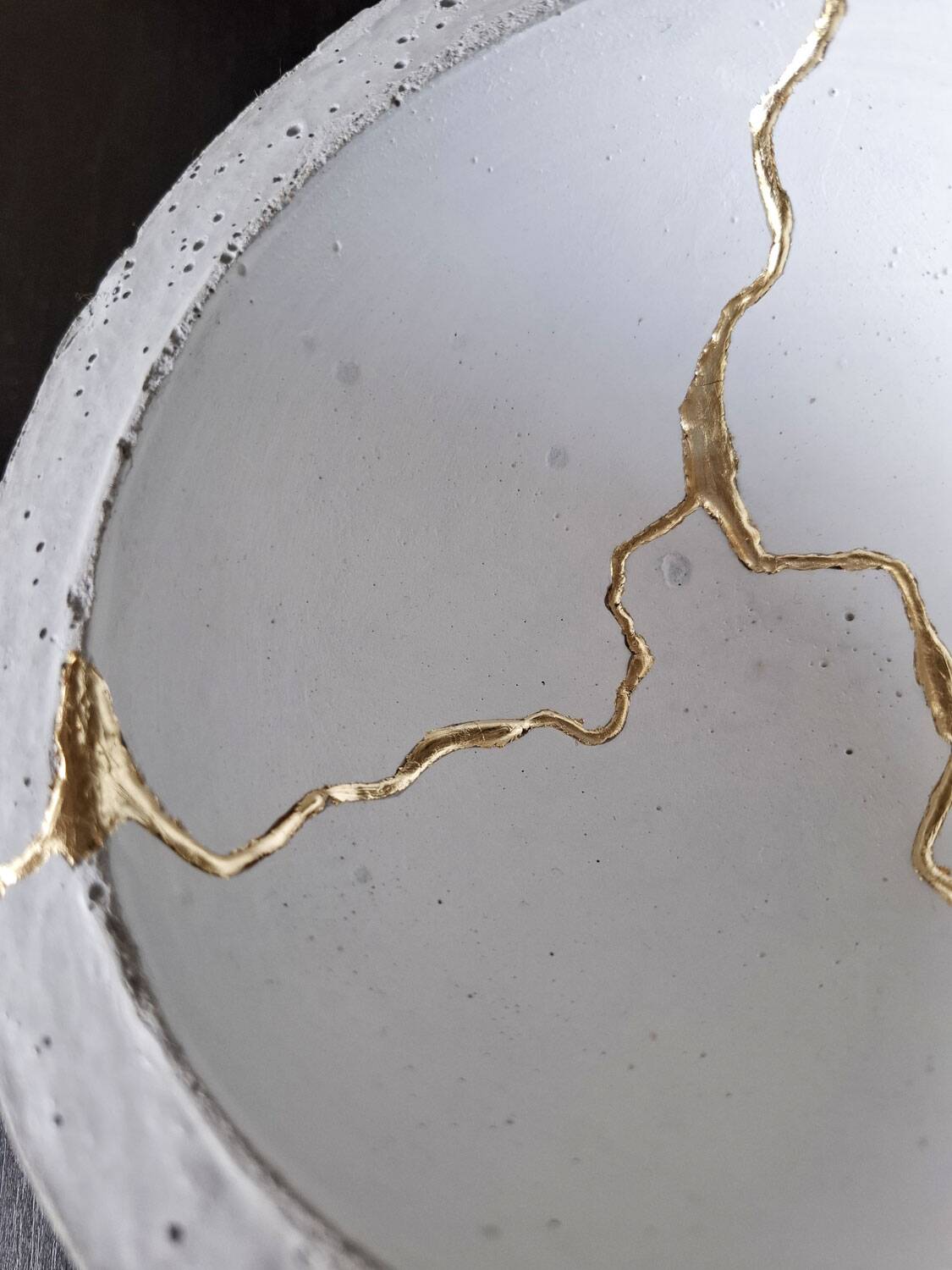 Kintsugi-inspired concrete and gold leaf cup