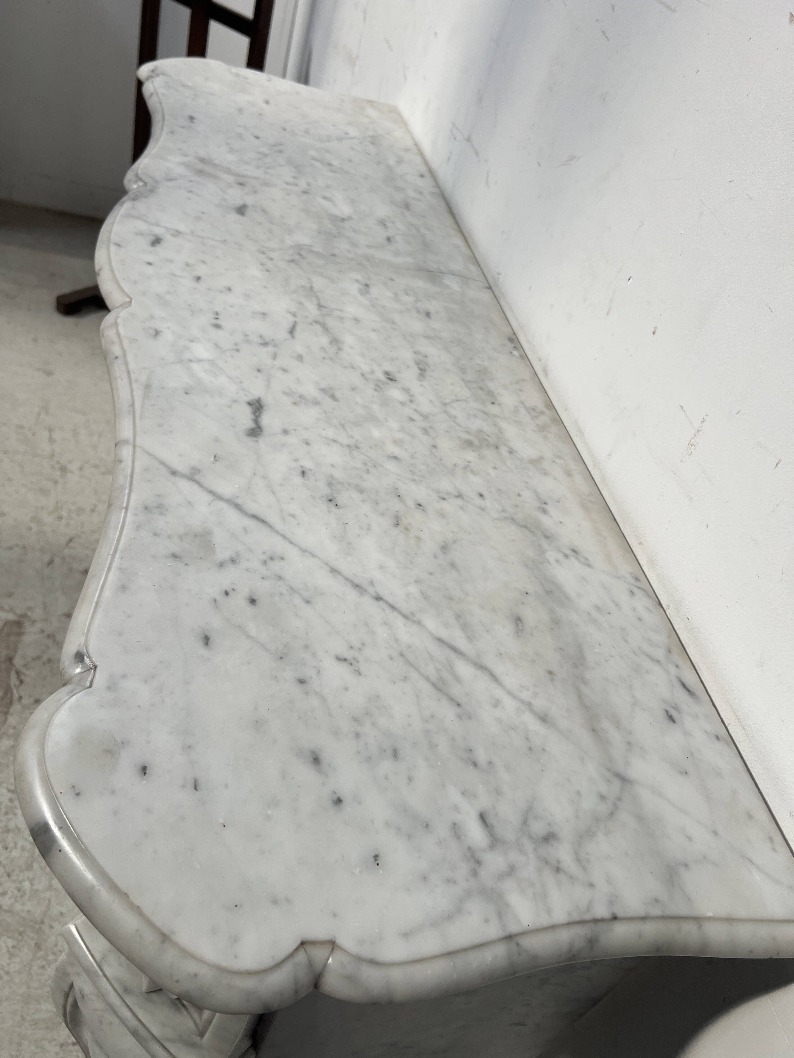 Louis XV style white Carrara marble fireplace, 19th century.