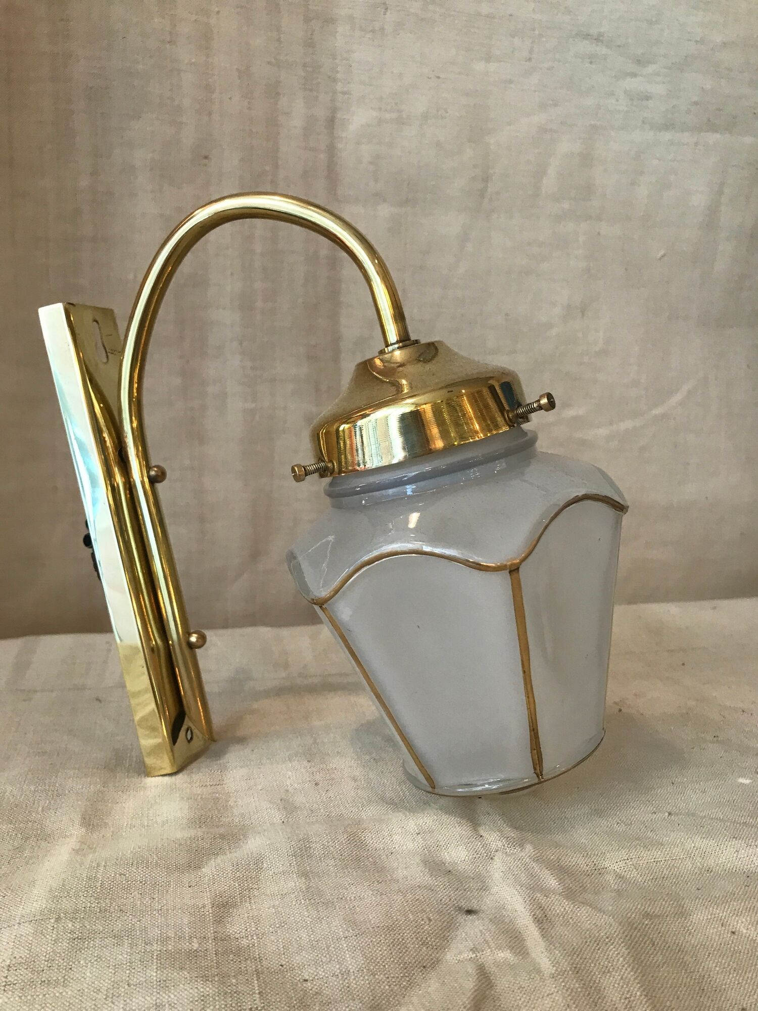 Pair of 1960 brass wall lamps and gilded frosted glass