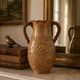 Large antique ceramic vase with two twisted handles.