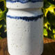 Pretty pot or vase in glazed stoneware with blue drip effect.