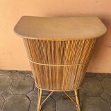 Vintage rattan bar from the 60s with rounded shapes and a shelf for glasses